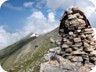 Approaching the summit ridge, where a big cairn signals the best way.