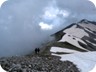 Having crossed the second summit and heading for the pass - the lowest point before the ridge again ascends. All other bumps on the ridge are no contenders for the main summit