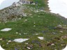 At the lowest point of the ridge, where the main trail crosses over to the summer meadows