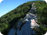 The path can be slightly airy, on the ascent of the first of the many summits along the ridge