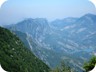 View from the summit area towards Gamnit and Kruja Mountains. Gamnit is the mountain with its steep (eastern) face. Endrit Shima has published a way up on his blog (http://www.endritstrail.blog.com) and wikiloc.