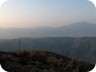 Near the trailhead at sunrise. The town of Kraste catching the first light. The pyramd of Mali i Snoijt in the distance on the right.