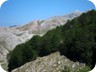 As we are climbing the grass couloir, the  summit of Polis comes into view.