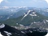 Maja e Gaferit, as seen from the summit of Polis, in May. The characteristic couloir, here filled with snow, presents itself for a straightforward, if steep, ascent.