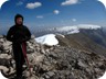 On the summit of Mali i Gribes, with a wind speed of 65 km/h. Kendervices in the distance.