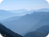 The view opens to Nemercka Mountain, Papingut, its summit, is almost in the center of the image