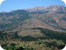 Fushë Lurës, and the Crown of Lura, seen from the road to Muhurr. The Lure Lakes are in the heavily wooded area.