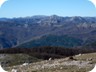 To the west, in the middle-ground is Mali i Shën Noj (appears as the twin peaks of Shën Noj madhe and Shën Noj vogel). Further away, on the left is Mali me Gropa. The dark ridge on the left is Dajti Mountain