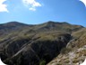 On the summit ridge. The summits are in clear view. According to our measurements (and the word of the owner of the Hotel in Sotire), the left summit is higher, though many maps show the right summit to be the highest. It also has an iron contraption on its top.