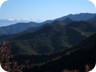 A rare glimpse of snow covered Ostrovice. More to the right, snow covered Tomorri mountain rises behind Mali i Gallushit. All peaks covered on separate pages.