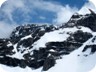 Point 2333 and the summit ridge, seen from below. With the sun at noon, the large cornices are now well visible.