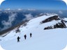 Descending from Papingut. In the distance is Cajupi Mountain, which we climbed the year before.