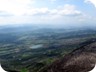 View from the ridge towards Tirana. The charred mountainside of the Priske ridge is in contrast to the lush fields near Tirana