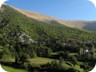 Stately houses in Lukan, with a view up Maja e Runjës.It may not look like it, but it is a climb of  about 100o meters.