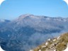 Mount Kendervicës appearing from the clouds