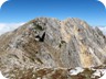 The main summit in view. From here, the true summit appears to be somewhere in the rocks - but it is at the end of the grassy ridge.