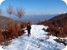 Hiking Mali i Sukes. In the far distance is the snow covered Mali i Munelles (see separate trail)