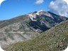 A distant view (from the slopes of Maja e Kulmakes) of the road leading from the guesthouse to the southern summit of Tomorri