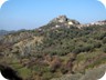 Having reached the dirt road from Petrele. This is an unusual view towards the rocks of Petrele Castle.