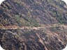 The road leads through areas recently burnt by wildfires
