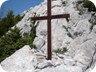 A cross at waypoint 8, where a path from Katundi i Vjetër joins the ridge.