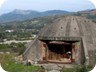 Approaching Librazhd from Elbasan. A bunker for hire. The route will disappear in front of the grey mountains in the far distance