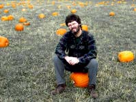 Detlef sitting on pumpkins